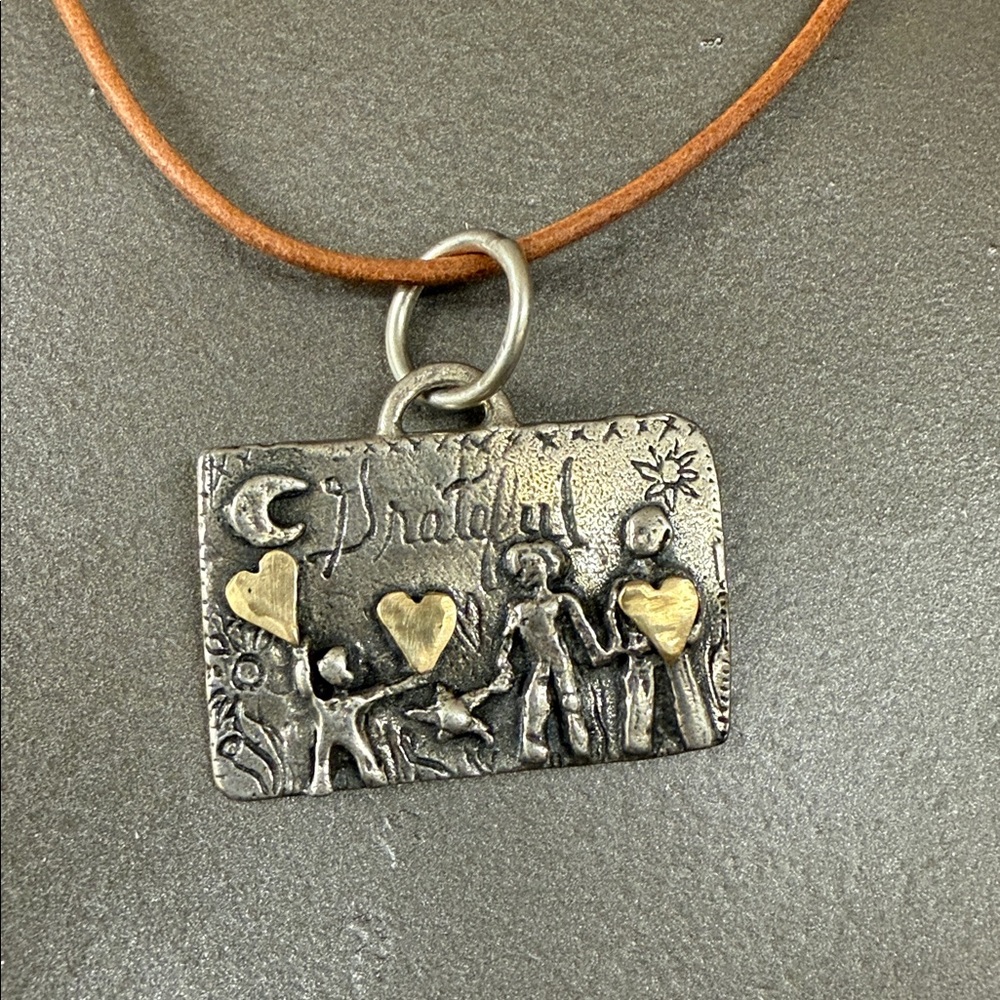 Jes MaHarry “Dream and Grow” Sterling Silver/gold charm leather cord necklace.